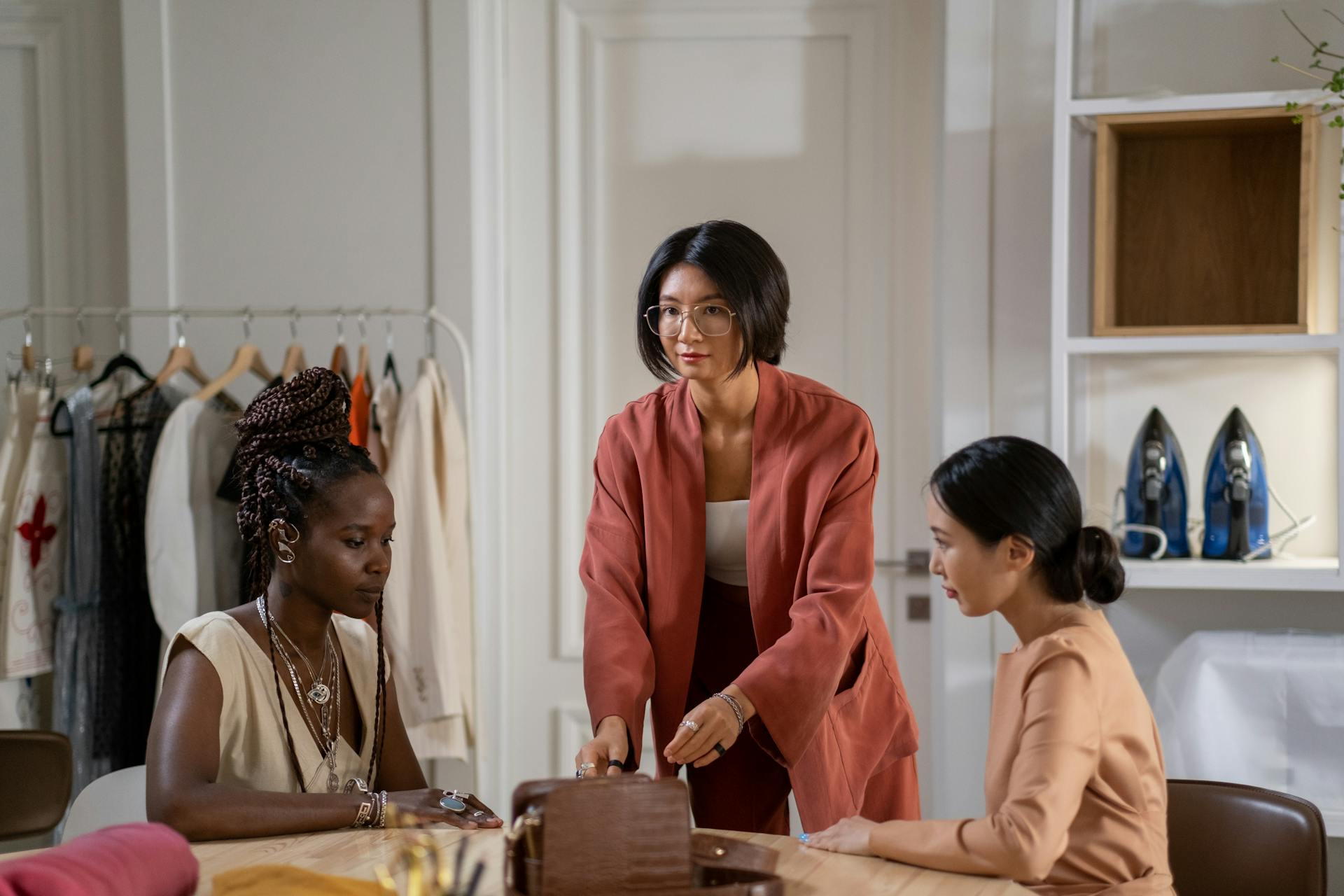 three women working in fashion